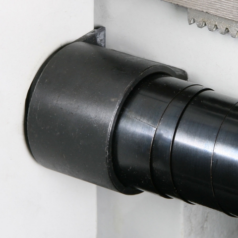 Telescoping lead screw cover properly installed in left bracket